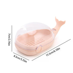 Whale Soap Holder - Light pink whale-shaped soap dish with clear flip-top cover, showing dimensions against a white background