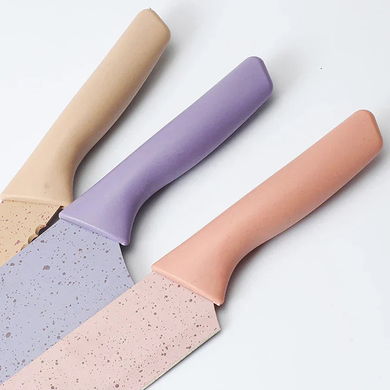 Organizer Box - Close-up of three speckled kitchen knife handles in beige, lavender, and pink, fanned on a white surface