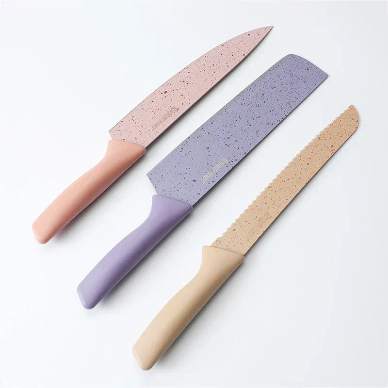 Organizer Box - Three speckled kitchen knives with pink, lavender, beige handles laid out on a white background