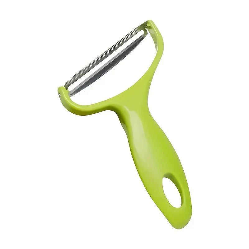 Vegetable Slicer - Green Y-shaped vegetable peeler with stainless steel blade, displayed against a plain white background.