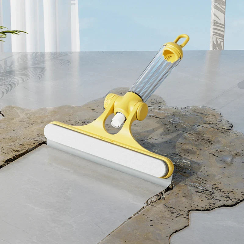 Herramienta limpiadora de ventanas: herramienta de limpieza manual amarilla con hoja blanca descansando sobre superficie de baldosas mojadas junto a baldosa seca, mango transparente con lazo para colgar