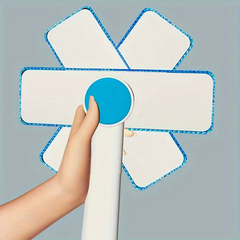 Squeegee - Close-up of hand pressing the blue circular pivot on the tool head, with six cleaning heads arranged radially around the pivot.