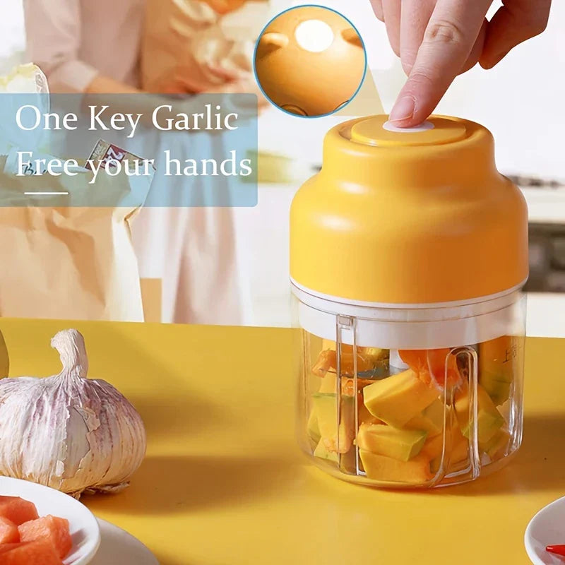 Close-up of the mini garlic chopper with fresh garlic cloves