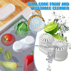 Fruit Vegetable Purifier Washer Capsule - Demonstration of the dual-core produce cleaner in a sink of water with fresh vegetables, showing water interaction during use