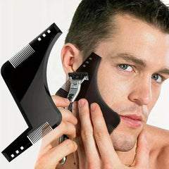 Wooden Beard Comb Mustache Styling Tool - Black grooming comb held against a man’s jawline alongside a razor to demonstrate beard line shaping use