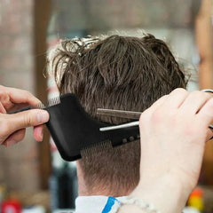Wooden Beard Comb Mustache Styling Tool - Black beard shaping tool held at the nape of a man's neck while hair is cut with shears