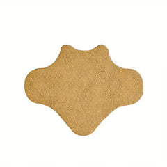 Single tan irregularly shaped heat patch on white background