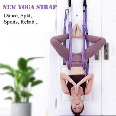 Stretching Strap - Person using purple over-door yoga strap in an inverted yoga pose against a white door.