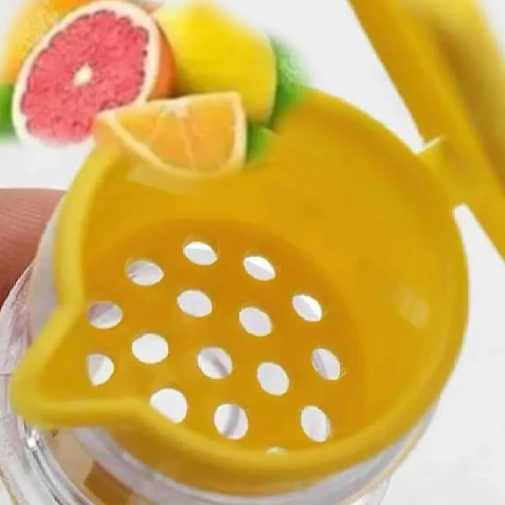 Close-up of yellow citrus reamer with holes, over glass with fruit slices in background