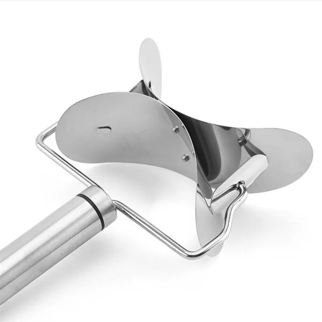 Close-up of stainless steel rolling dumpling cutter head