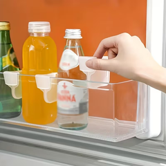 Adjustable fridge dividers on a refrigerator shelf