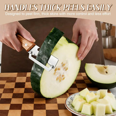 Stainless Steel Vegetable Peeler - Hands use a wood-handled peeler to peel a thick green-skinned winter melon on a checkered cutting board, with cut melon cubes on a plate nearby.