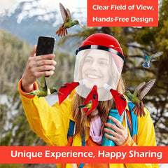 Hummingbird Feeder Helmet - Person wearing the feeder taking a smartphone photo outdoors, with hummingbirds feeding at the ports