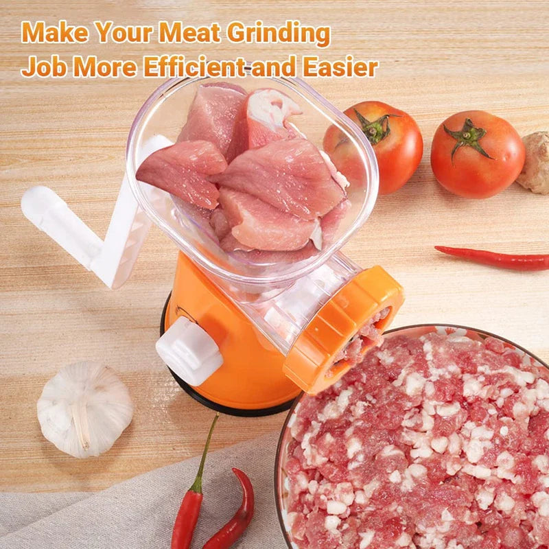 Mincer - Overhead view of an orange manual meat grinder processing raw meat into a bowl, with tomatoes and garlic nearby