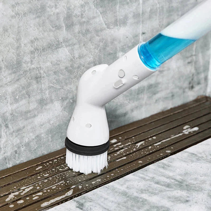 Electric Spin Scrubber - Powered cleaning brush scrubbing soapy residue from a sloped bathroom shower drain track