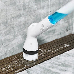 Electric Spin Scrubber - Powered cleaning brush scrubbing soapy residue from a sloped bathroom shower drain track