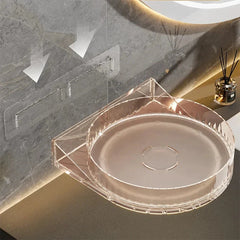 Clear wall-mounted corner organizer with adhesive wall mounts, paired with a spice rack cabinet on a bathroom vanity.