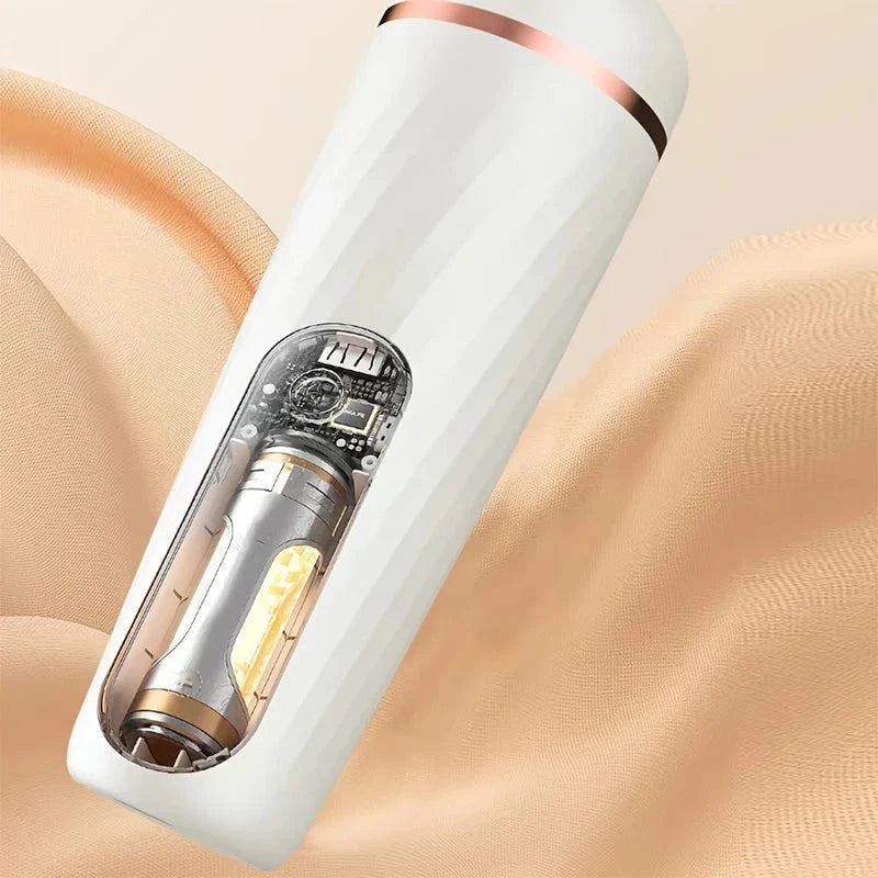 Cutaway view of white electric foot callus remover with visible internal components, resting on beige fabric