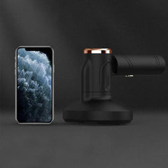 Cordless Handheld Vacuum - Black UV dust mite vacuum next to smartphone for size comparison