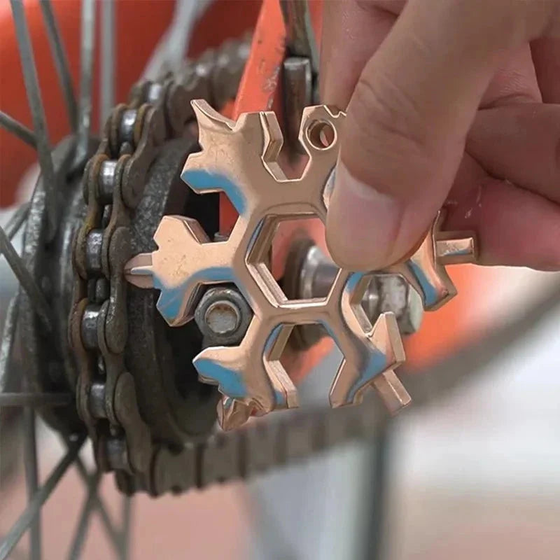 Snowflake multitool wrench used on bicycle chain repair