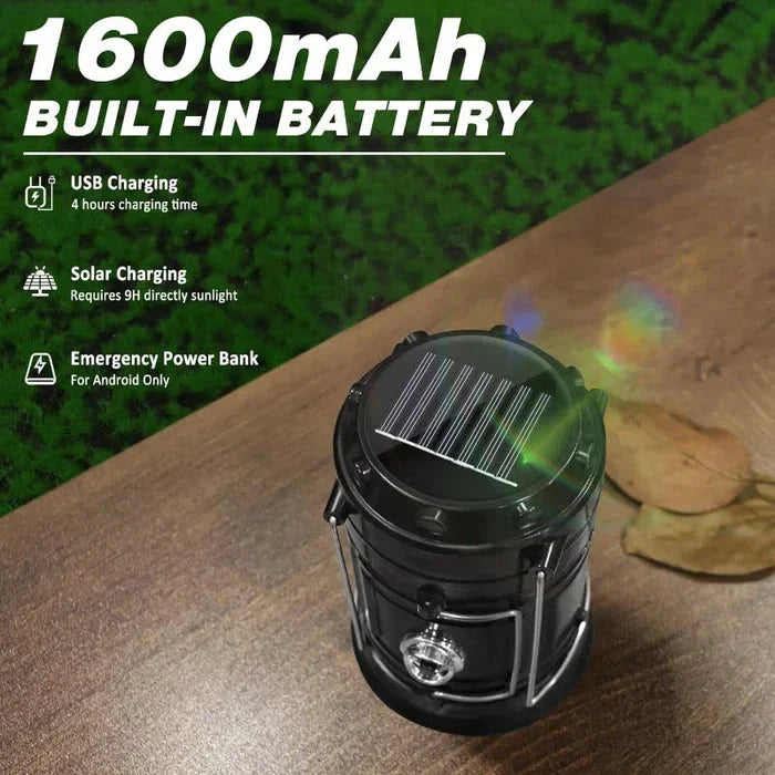 Top view of black camping lantern with a solar panel on its top, on a wooden surface, text reads 1600mAh BUILT-IN BATTERY with charging details