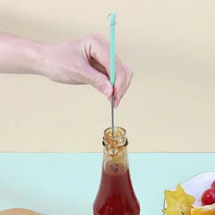Mini Silicone Telescopic Spatula - Hand holds a small silicone-tipped tool inserted into a glass ketchup bottle to reach sauce inside.