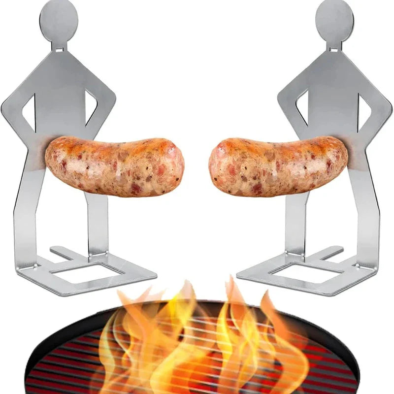 Funny Sausage Grill - Two stainless steel human-shaped stands each holding a sausage above a flaming grill