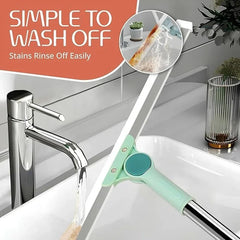 Magic Broom - Mint and stainless steel cleaning squeegee rinsed under a chrome bathroom faucet, with inset showing stains washing off the blade