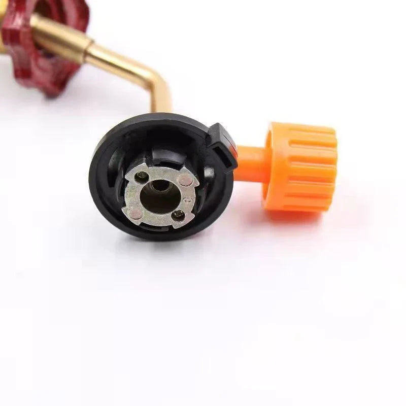 Outdoor Gas Canister Refill Adapter - Close-up of the canister connection end of a brass gas adapter with an orange valve knob.