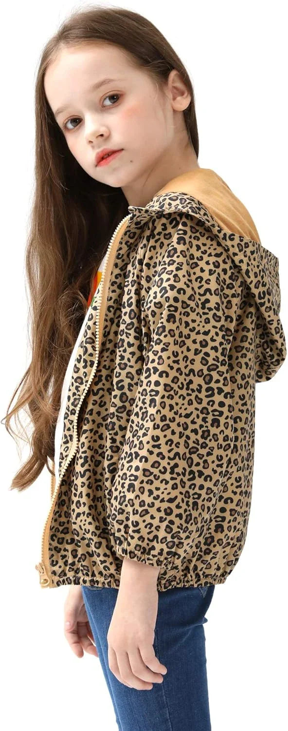 Girl facing left wears a leopard print hooded jacket with tan hood lining, open over a white top, paired with blue jeans