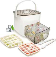 White portable ice maker set with two ice cube trays, ice tongs, and a drawer of frozen fruit ice cubes