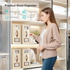 Bed Sheet Organizer - Woman stands beside closet shelves holding four beige fabric sheet organizers with front windows, handles, and labels, with an upper overlay listing four product traits.