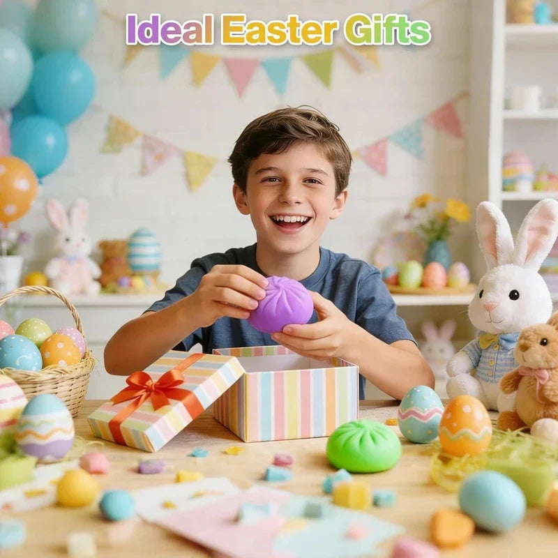 Stress Relief Toy - A smiling boy holds a purple bun-shaped toy over an open gift box at a table decorated with Easter-themed items.