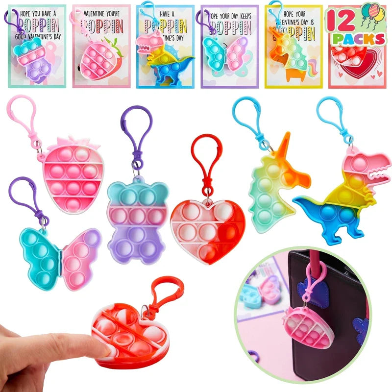 12-pack set of assorted pop fidget keychain toys in animal and heart shapes, with attached valentines day cards with pop fidget keychains shown at top.