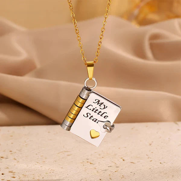 Book Necklace - Two-tone gold and silver book pendant on gold chain, engraved 'My Little Star' with a small gold heart accent and side clasp