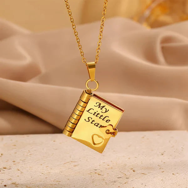 miniature book necklace on a chain with a star charm