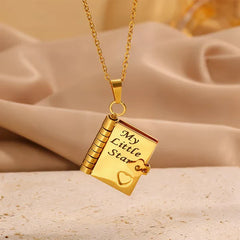 miniature book necklace on a chain with a star charm