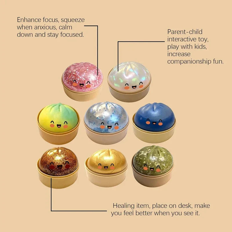 Steamer Basket - Eight kawaii-faced glitter and gradient squeeze buns in small steamers arranged in three rows, with three text labels connected by lines