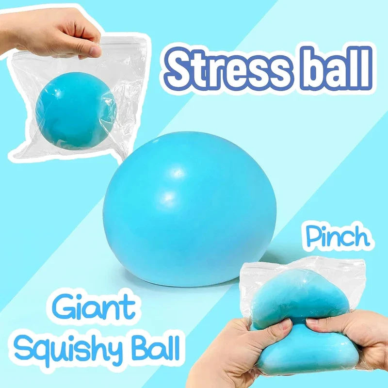 Giant Stress Ball - Light blue squishy ball shown in clear storage bag, with demonstration of pinching the squishy through the bag