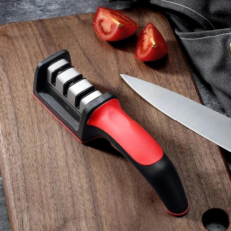 Knife Sharpener Tool - sharpening tool placed on wooden cutting board beside knife and tomato wedges