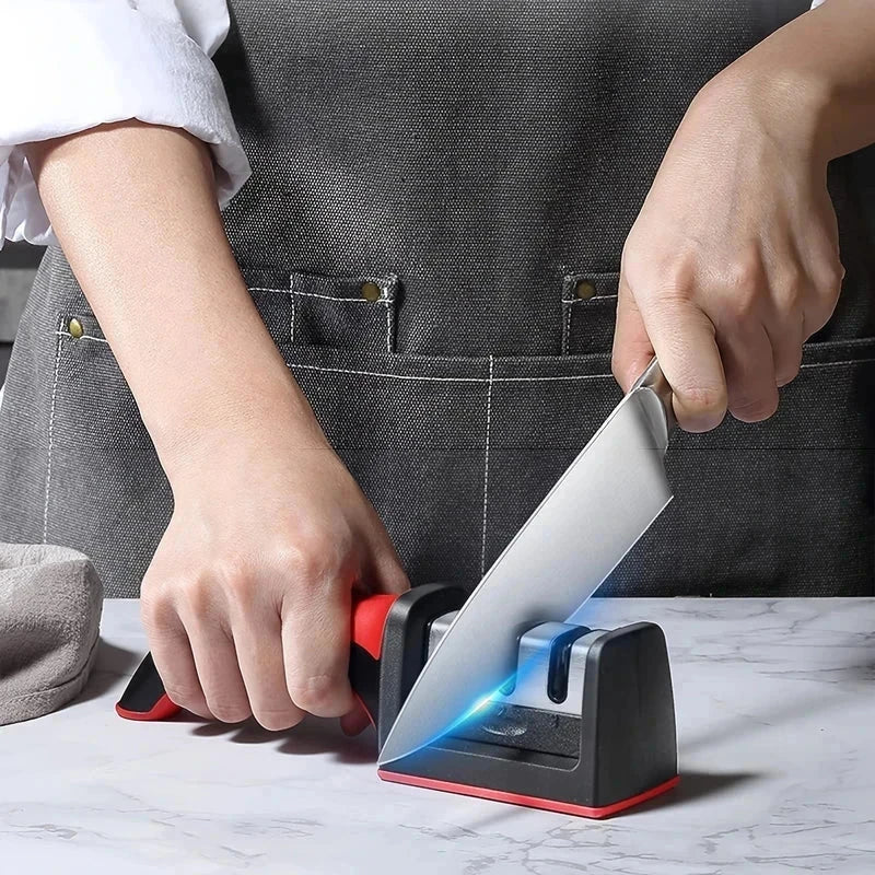 Knife Sharpener Tool - person using handheld sharpening tool to sharpen a kitchen knife on countertop