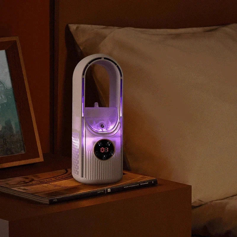 Tower Fan - White bladeless fan with purple LED lights sitting on a nightstand with a pillow and framed picture in the background