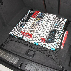 Boxed electronics secured by a cargo net organizer in a car trunk