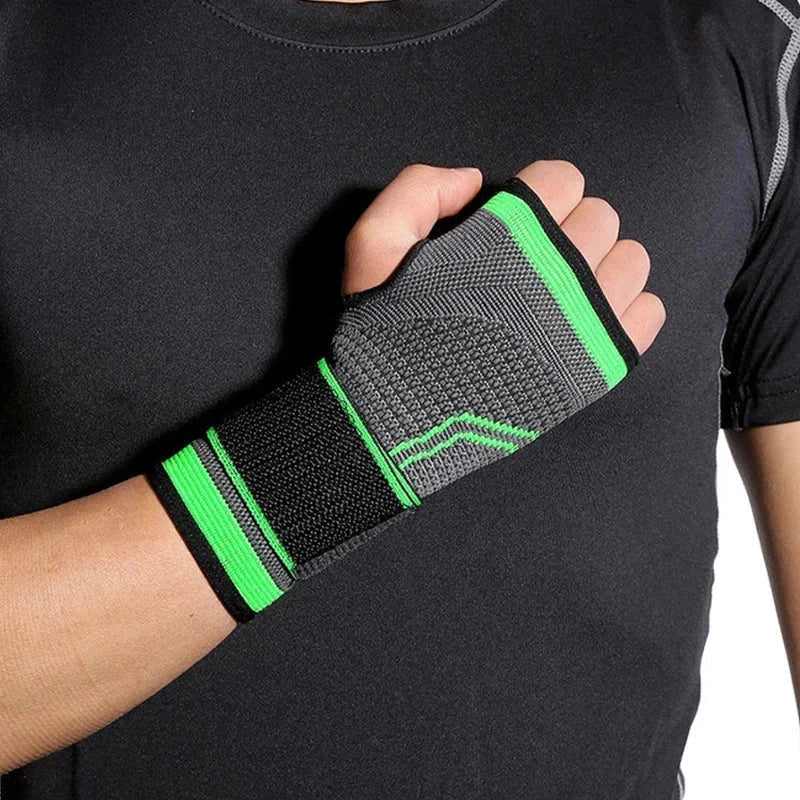 Compression Palm Hand Brace Glove - A person wearing a black shirt has a gray, black, and bright green knit wrist and palm support on their hand held to their chest.