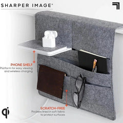 Felt Bedside Caddy Organizer Pocket Bag - Caddy installed hanging over a bed edge, holding earbuds, wallet, notebook, and reading glasses