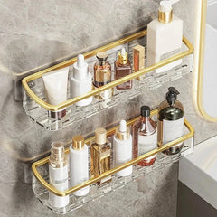 Floating Shelf - Two identical rectangular wall-mounted shelves with gold trim holding skincare bottles, mounted on a gray tiled wall