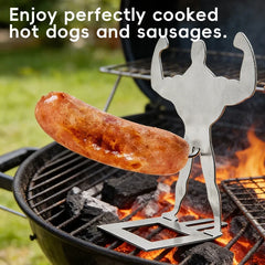 Funny Sausage Grill - Single muscle-man silhouette metal holder holding a cooked sausage on a charcoal grill with visible hot coals