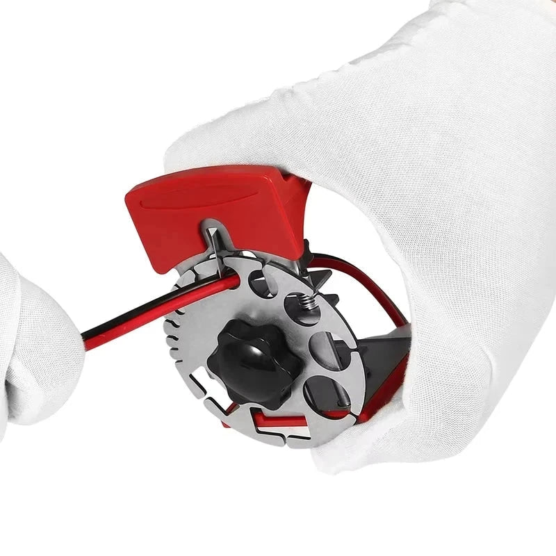 Handheld Wire Quick Stripper - Gloved hands positioning a red and black coated rod against the blade of the hand tool