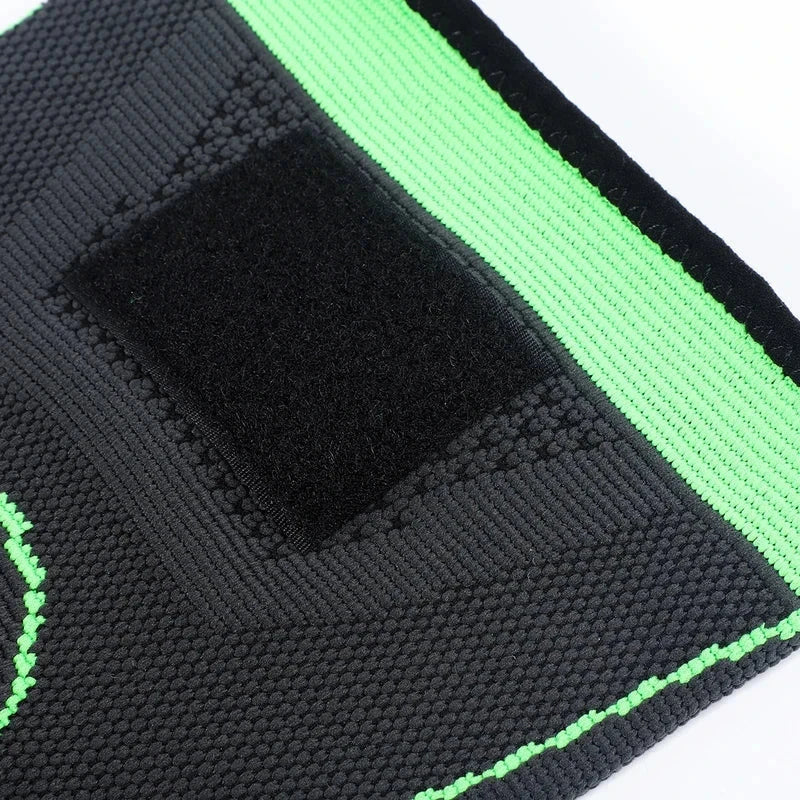 Compression Sleeve - Close-up of a black and bright green textured knit support strap with a black hook-and-loop fastener patch