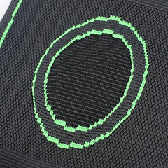 Compression Sleeve - Close-up of black knit fabric with bright green stitched oval ring patterns